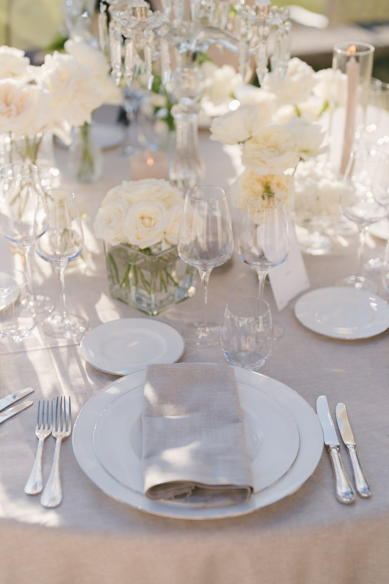 Tiered wedding cake set against Champlatreux silver and stucco